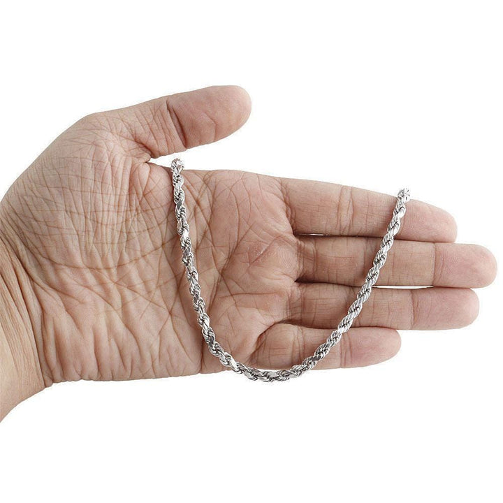 white gold rope chain on hand