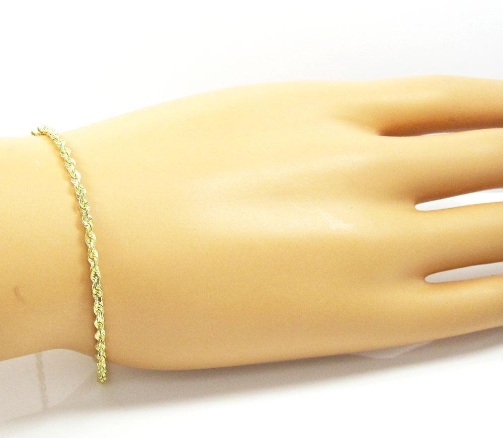 gold rope chain bracelet on hand