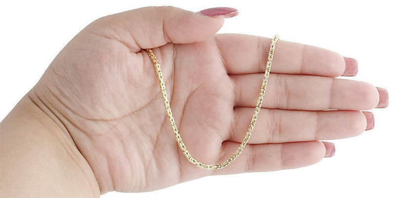 gold byzantine chain on hand