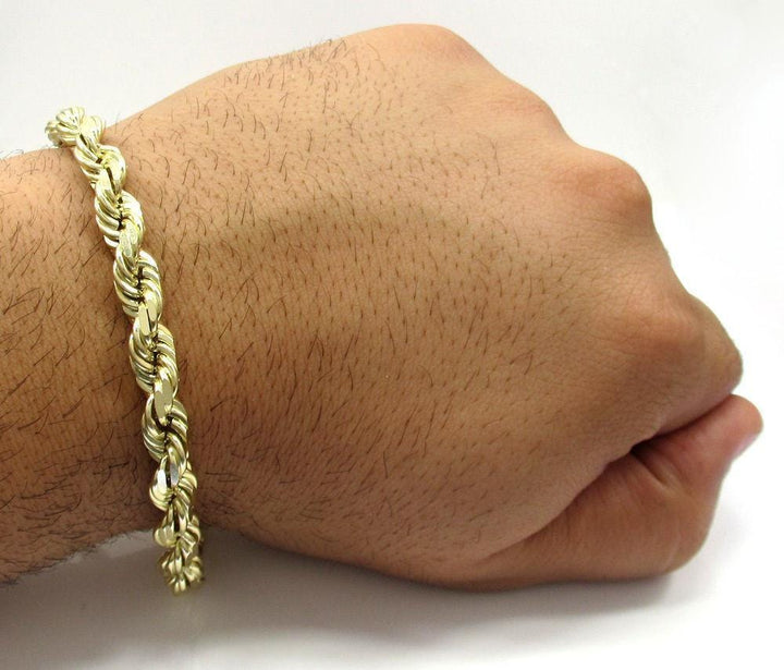 gold rope chain bracelet on hand