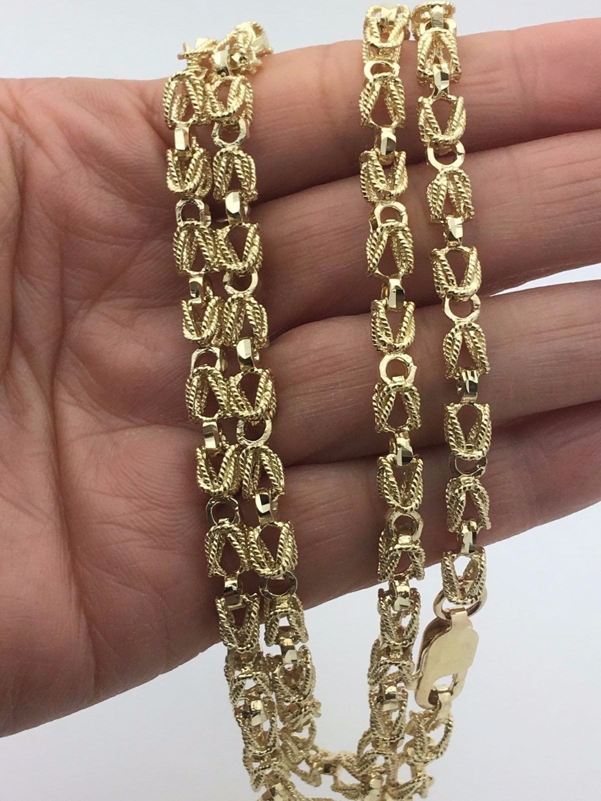 turkish gold chains on hand