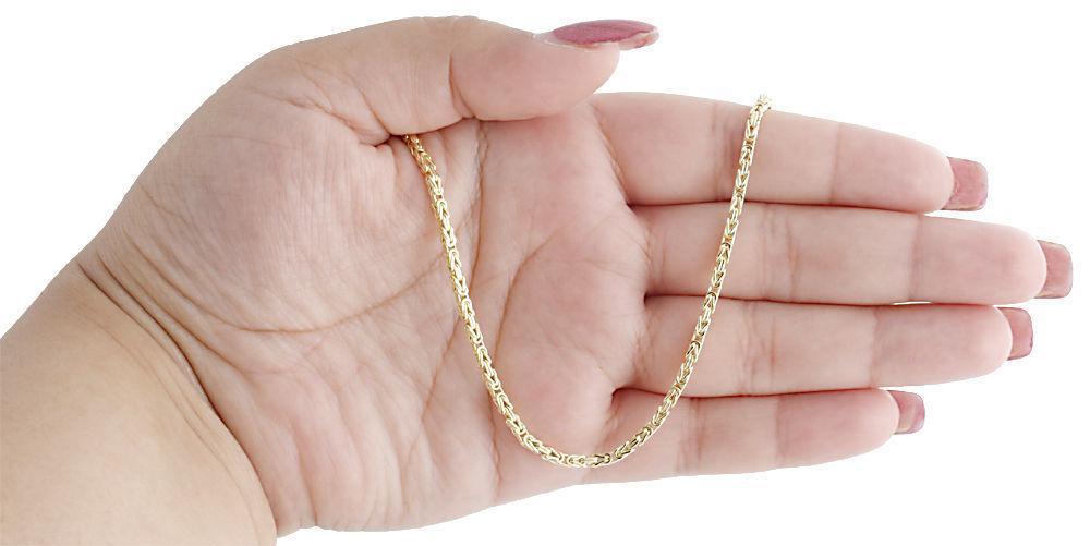 gold pave byzantine chain on hand